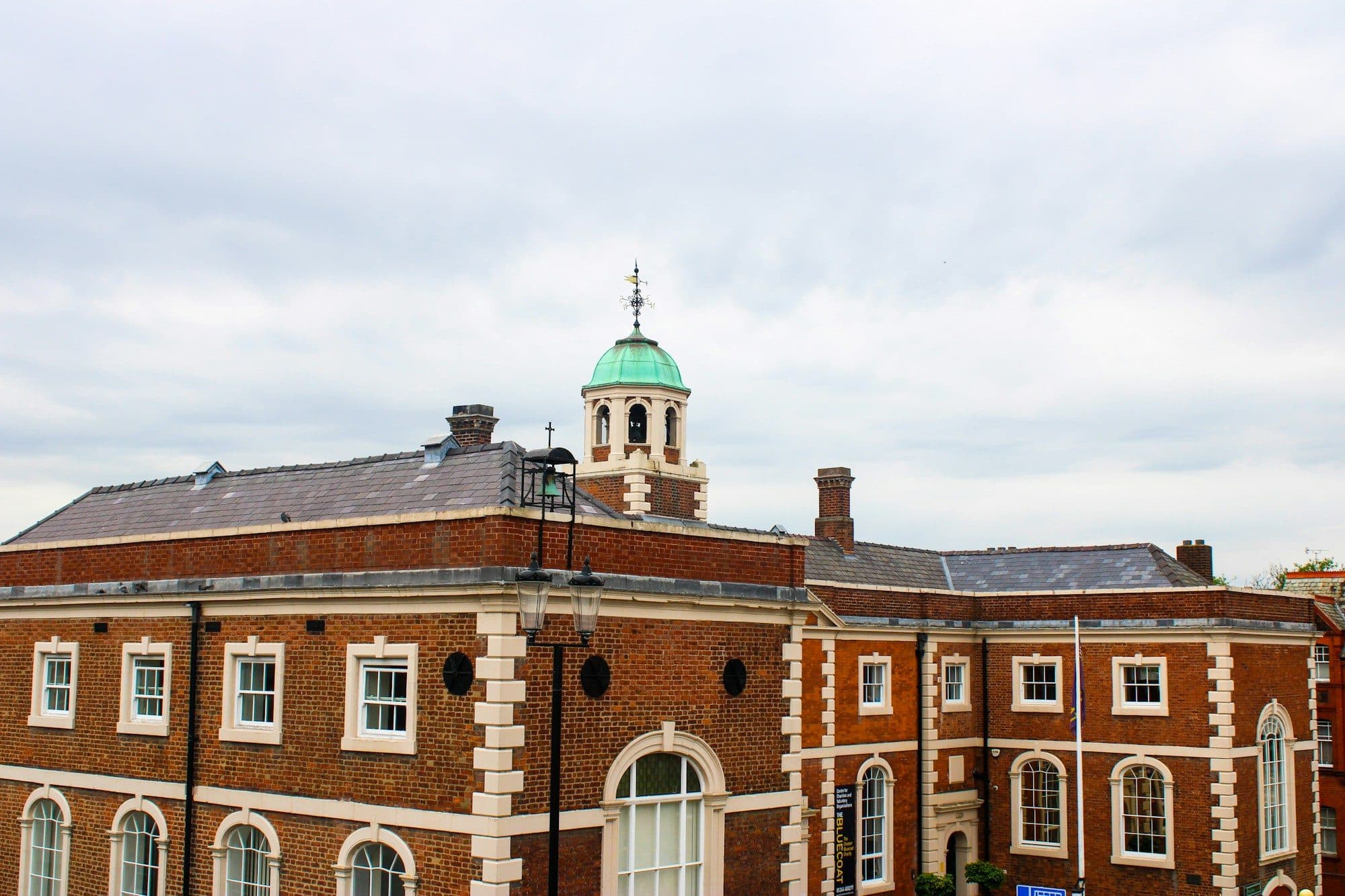 Victorian red-brick school building with a clock tower