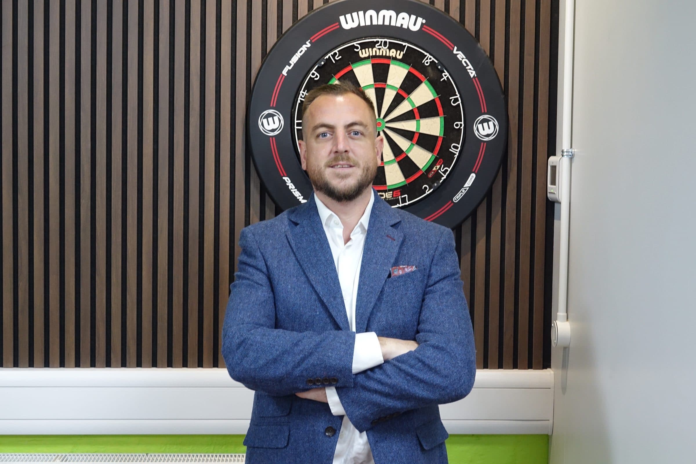 Shane Pritchard standing with arms folded